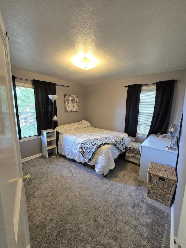 1117 E Garland Ave, Spokane, WA 99207 - carpeted bedroom featuring a textured ceiling