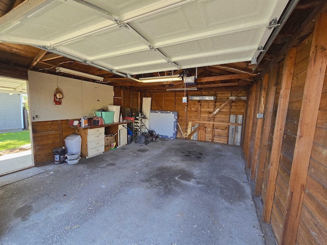 1117 E Garland Ave, Spokane, WA 99207 - garage with wood walls and a garage door opener
