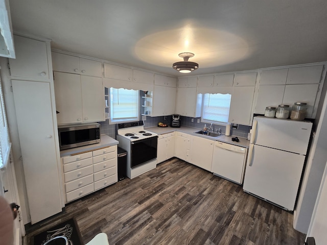 1117 E Garland Ave, Spokane, WA 99207 - kitchen featuring white appliances, a sink, white cabinets, light countertops, and dark wood-style flooring