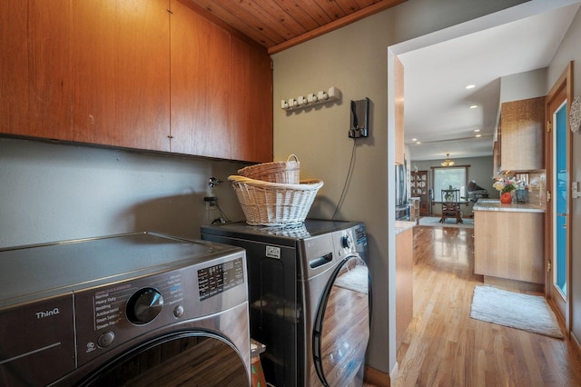 934 E 38th Ave, Spokane, WA 99203 - laundry area featuring washing machine and dryer, cabinet space, light wood-style floors, and recessed lighting