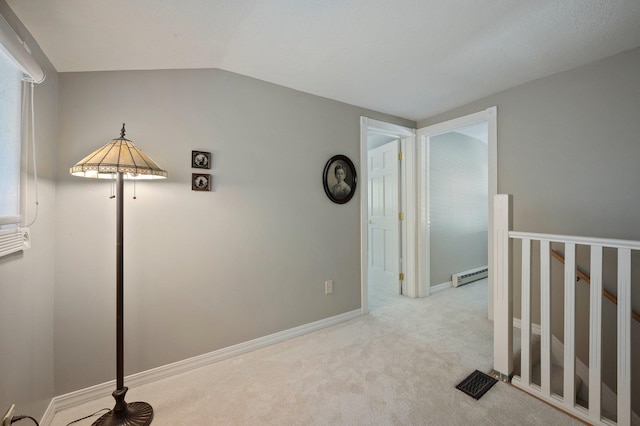 934 E 38th Ave, Spokane, WA 99203 - hall featuring baseboard heating, carpet flooring, vaulted ceiling, and an upstairs landing