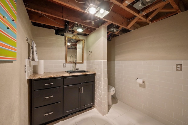 934 E 38th Ave, Spokane, WA 99203 - bathroom with tile patterned flooring, vanity, wainscoting, and tile walls