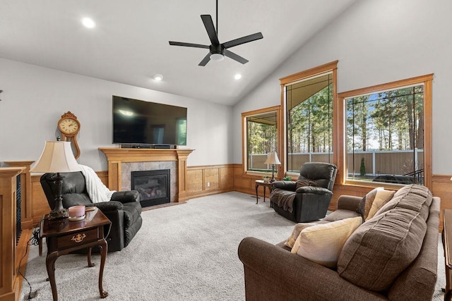 1220 E Fireside Ln, Spokane, WA 99208 - carpeted living area with wainscoting, a ceiling fan, recessed lighting, a tile fireplace, and high vaulted ceiling