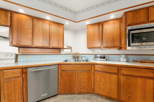1470 State Route 174th Rte, Grand Coulee, WA 99133 - kitchen with stainless steel appliances, a sink, light countertops, brown cabinets, and recessed lighting