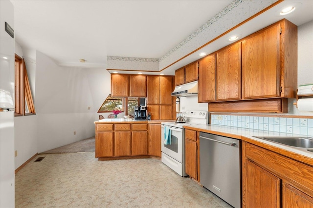1470 State Route 174th Rte, Grand Coulee, WA 99133 - kitchen with dishwasher, white electric stove, under cabinet range hood, brown cabinets, and light countertops