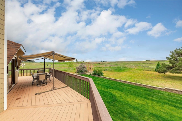 1470 State Route 174th Rte, Grand Coulee, WA 99133 - wooden deck featuring outdoor dining space, a yard, and a view of rural / pastoral area