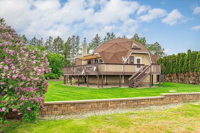 1470 State Route 174th Rte, Grand Coulee, WA 99133 - rear view of house with a wooden deck, stairs, a chimney, central air condition unit, and a yard