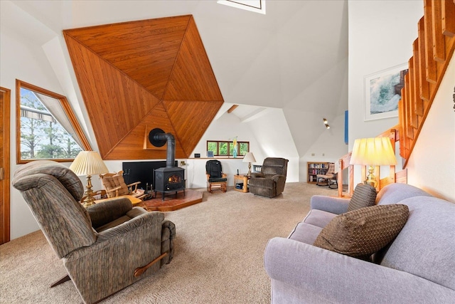 1470 State Route 174th Rte, Grand Coulee, WA 99133 - carpeted living room featuring a wood stove and high vaulted ceiling
