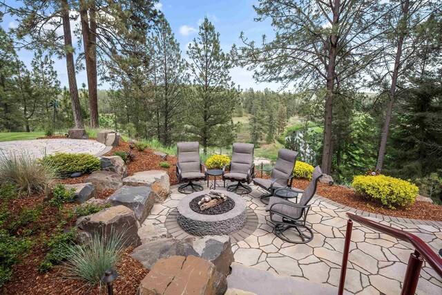 13411 S Bluegrouse Ln, Spokane, WA 99224 - view of patio with a fire pit