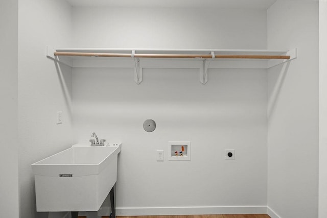 101 S W St, Chewelah, WA 99109 - washroom with electric dryer hookup, hookup for a washing machine, wood finished floors, and baseboards