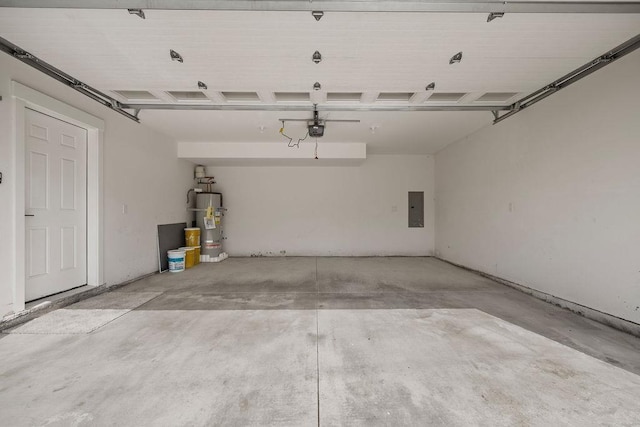 101 S W St, Chewelah, WA 99109 - garage with electric panel, water heater, and a garage door opener