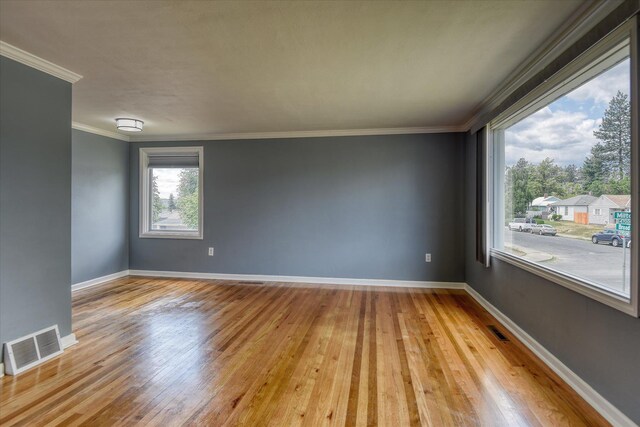 2729 W Broad Ave, Spokane, WA 99205 - spare room featuring hardwood / wood-style flooring, crown molding, and baseboards