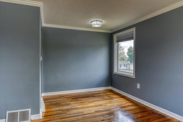 2729 W Broad Ave, Spokane, WA 99205 - unfurnished room with ornamental molding, wood finished floors, and baseboards