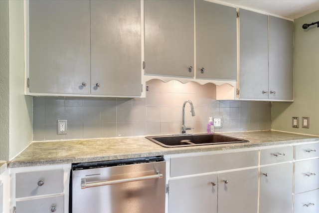 2729 W Broad Ave, Spokane, WA 99205 - kitchen with dishwasher, a sink, light countertops, and backsplash