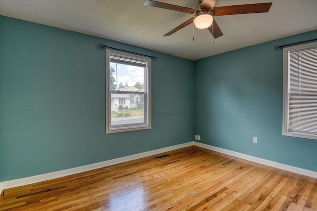 2729 W Broad Ave, Spokane, WA 99205 - empty room with wood finished floors, ceiling fan, and baseboards