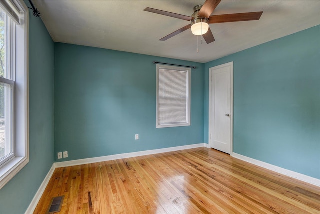 2729 W Broad Ave, Spokane, WA 99205 - spare room with wood finished floors, healthy amount of natural light, ceiling fan, and baseboards