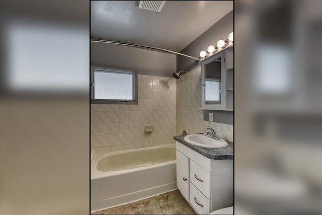 2729 W Broad Ave, Spokane, WA 99205 - full bathroom featuring shower / bathtub combination, vanity, tasteful backsplash, and tile patterned flooring