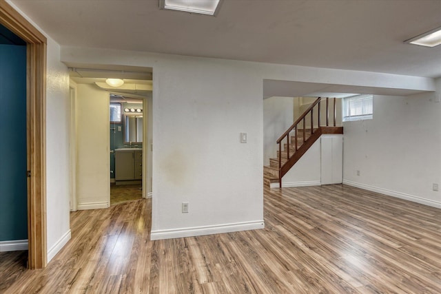2729 W Broad Ave, Spokane, WA 99205 - empty room with wood finished floors, baseboards, and stairway