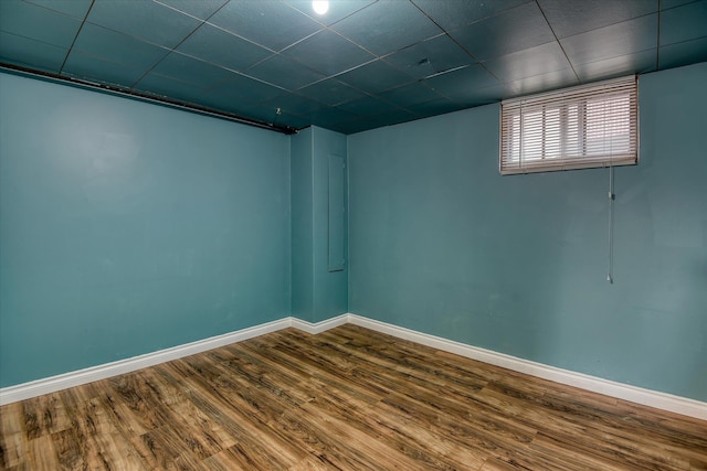 2729 W Broad Ave, Spokane, WA 99205 - unfurnished room featuring dark wood-style flooring, baseboards, and a drop ceiling