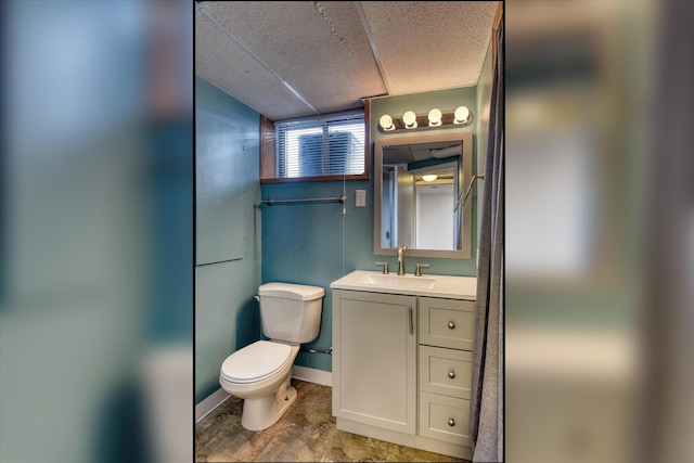 2729 W Broad Ave, Spokane, WA 99205 - bathroom featuring toilet, vanity, and baseboards