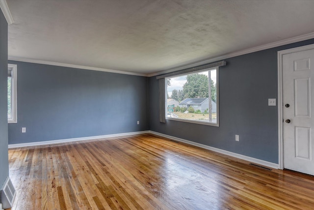 2729 W Broad Ave, Spokane, WA 99205 - empty room with hardwood / wood-style floors, baseboards, and ornamental molding