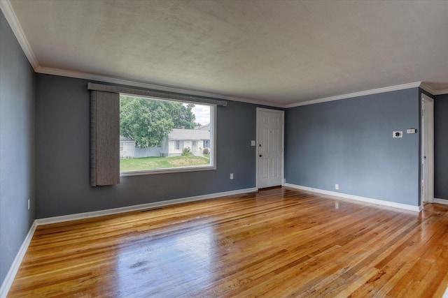 2729 W Broad Ave, Spokane, WA 99205 - unfurnished room with wood finished floors, crown molding, and baseboards