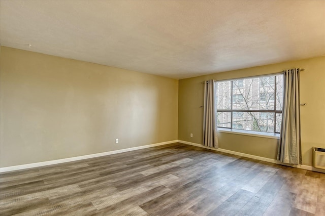 707 W 6th Ave # 33, Spokane, WA 99204 - spare room with dark wood-style floors and baseboards