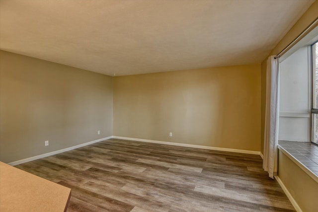 707 W 6th Ave # 33, Spokane, WA 99204 - spare room with wood finished floors and baseboards