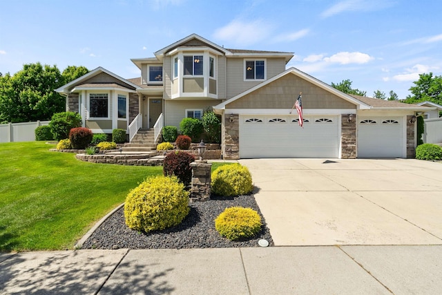 1212 S Drummond Rd, Greenacres, WA 99016 - view of front facade with an attached garage, driveway, and stone siding