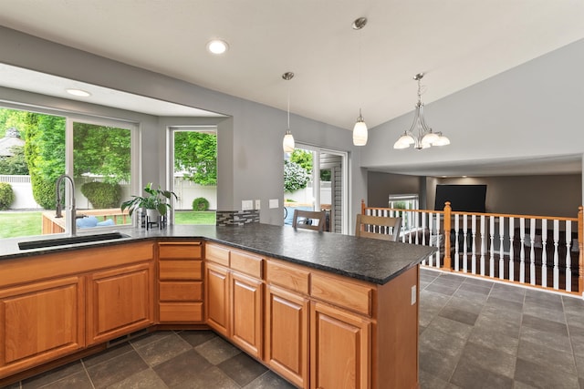 1212 S Drummond Rd, Greenacres, WA 99016 - kitchen featuring a sink, vaulted ceiling, dark stone finish flooring, a chandelier, and decorative light fixtures