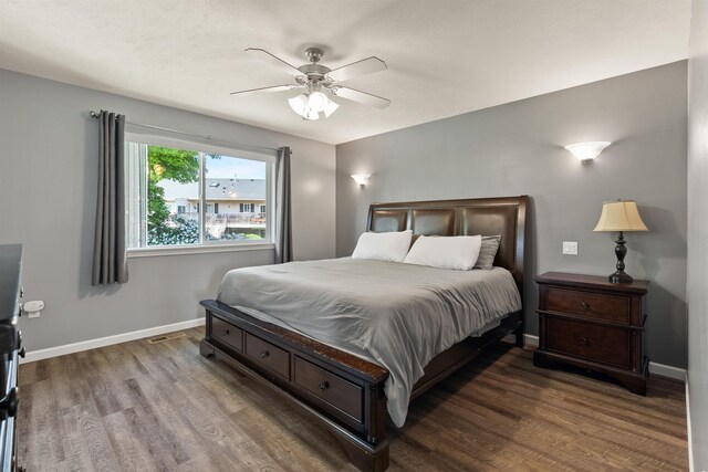 1212 S Drummond Rd, Greenacres, WA 99016 - bedroom with wood finished floors, baseboards, and a ceiling fan
