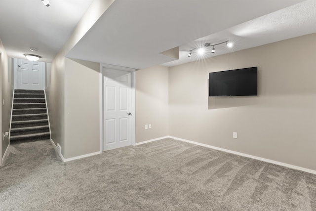 1212 S Drummond Rd, Greenacres, WA 99016 - finished basement with rail lighting, carpet flooring, baseboards, and stairway