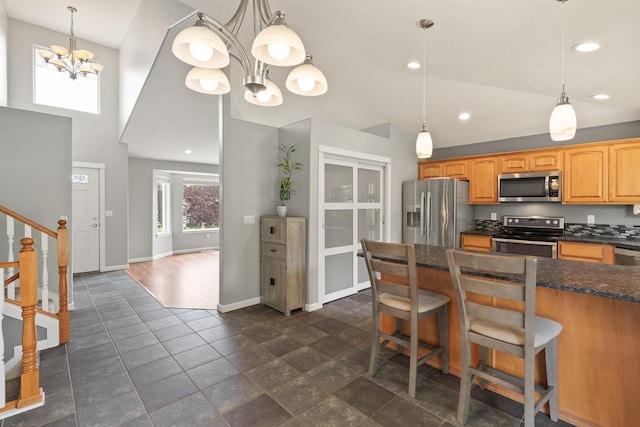 1212 S Drummond Rd, Greenacres, WA 99016 - kitchen with stainless steel appliances, a chandelier, baseboards, a towering ceiling, and recessed lighting