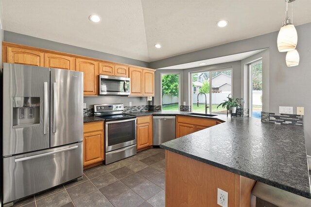 1212 S Drummond Rd, Greenacres, WA 99016 - kitchen with appliances with stainless steel finishes, a sink, dark countertops, a peninsula, and recessed lighting