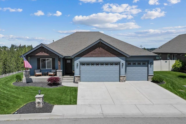 696 W Basalt Ridge Dr, Spokane, WA 99224 - view of front of property with an attached garage, driveway, and stone siding