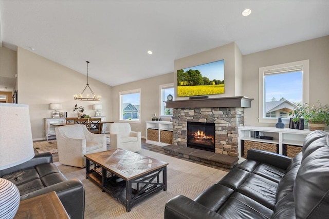 696 W Basalt Ridge Dr, Spokane, WA 99224 - living room featuring a fireplace, baseboards, lofted ceiling, a chandelier, and recessed lighting