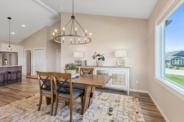 696 W Basalt Ridge Dr, Spokane, WA 99224 - dining space featuring a chandelier, wood finished floors, beamed ceiling, high vaulted ceiling, and baseboards