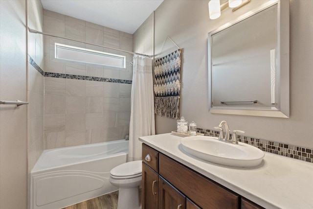 696 W Basalt Ridge Dr, Spokane, WA 99224 - bathroom with vanity, wood finished floors, toilet, and shower / bathtub combination with curtain