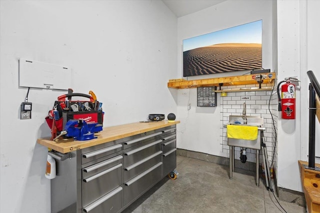 696 W Basalt Ridge Dr, Spokane, WA 99224 - miscellaneous room with concrete flooring and a sink