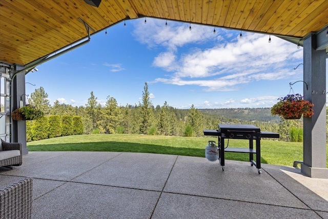 696 W Basalt Ridge Dr, Spokane, WA 99224 - view of patio with a forest view