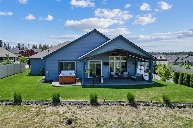 696 W Basalt Ridge Dr, Spokane, WA 99224 - rear view of property featuring a hot tub and a patio area