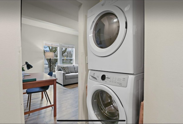1702 W Dean Ave, Spokane, WA 99201 - laundry area featuring stacked washer / dryer, wood finished floors, and an office area