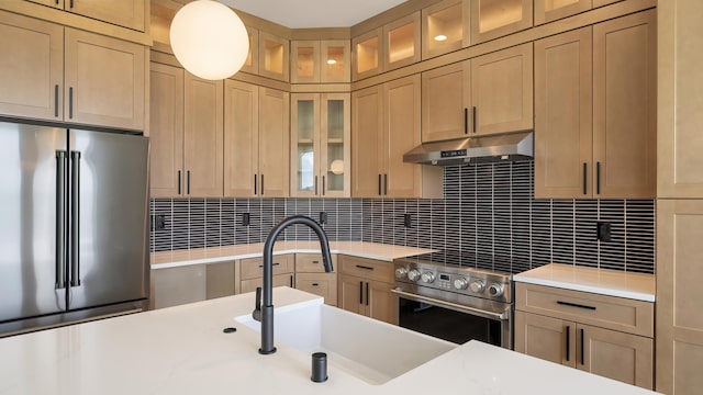 8521 W Dahl Rd, Deer Park, WA 99006 - kitchen with stainless steel appliances, under cabinet range hood, and light countertops