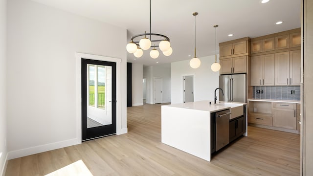 8521 W Dahl Rd, Deer Park, WA 99006 - kitchen with light wood-type flooring, baseboards, light countertops, recessed lighting, and tasteful backsplash