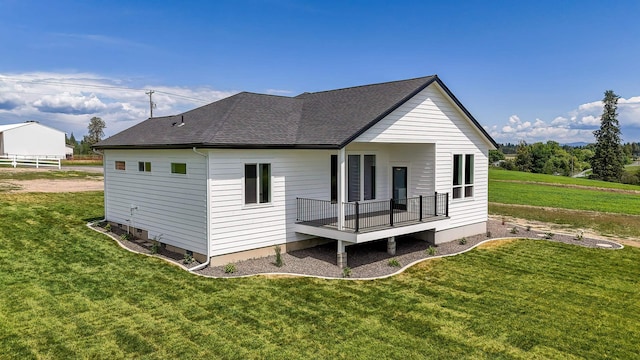 8521 W Dahl Rd, Deer Park, WA 99006 - back of house featuring a yard, roof with shingles, and a deck