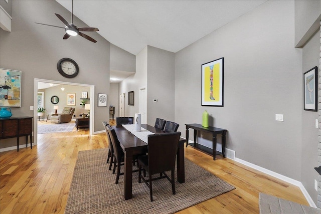 21123 S Cheney Spangle Rd, Cheney, WA 99004 - dining room with a ceiling fan, light wood-style flooring, baseboards, and high vaulted ceiling