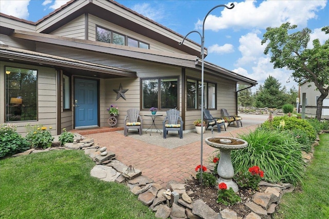21123 S Cheney Spangle Rd, Cheney, WA 99004 - rear view of house featuring a patio and a yard