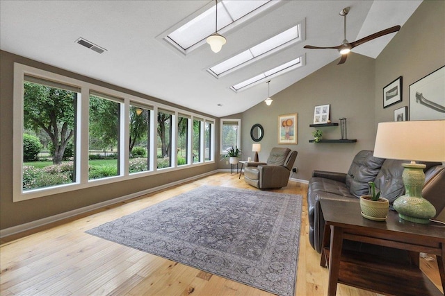 21123 S Cheney Spangle Rd, Cheney, WA 99004 - living room with a skylight, high vaulted ceiling, wood finished floors, a ceiling fan, and baseboards