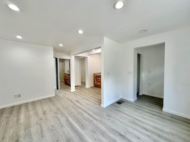 30710 N Newport Hwy, Chattaroy, WA 99003 - spare room featuring light wood-style flooring, baseboards, and recessed lighting