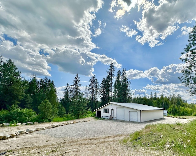 30710 N Newport Hwy, Chattaroy, WA 99003 - detached garage featuring a wooded view